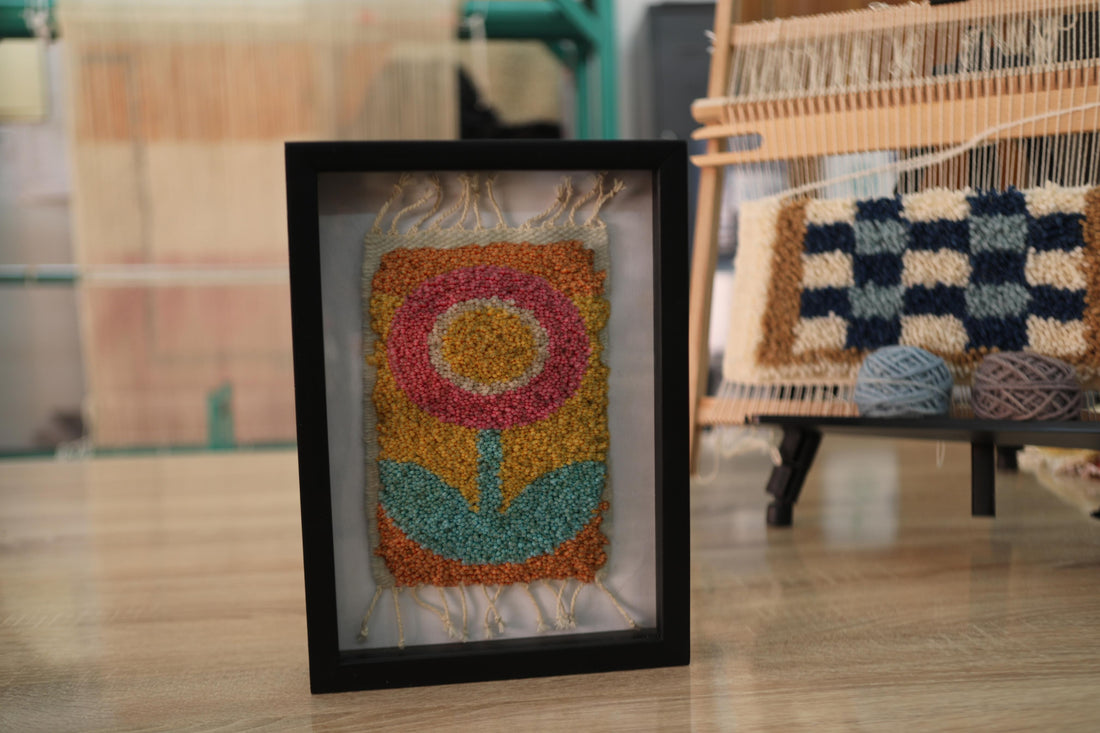 retro flower rug, moroccan rug wall art, hand-knotted wool textile, framed mini rug decor, vintage flower wall hanging, yellow orange pink flower rug, handmade wool tapestry, 25x31 cm rug art, knot by knot rug, bohemian floral decor
