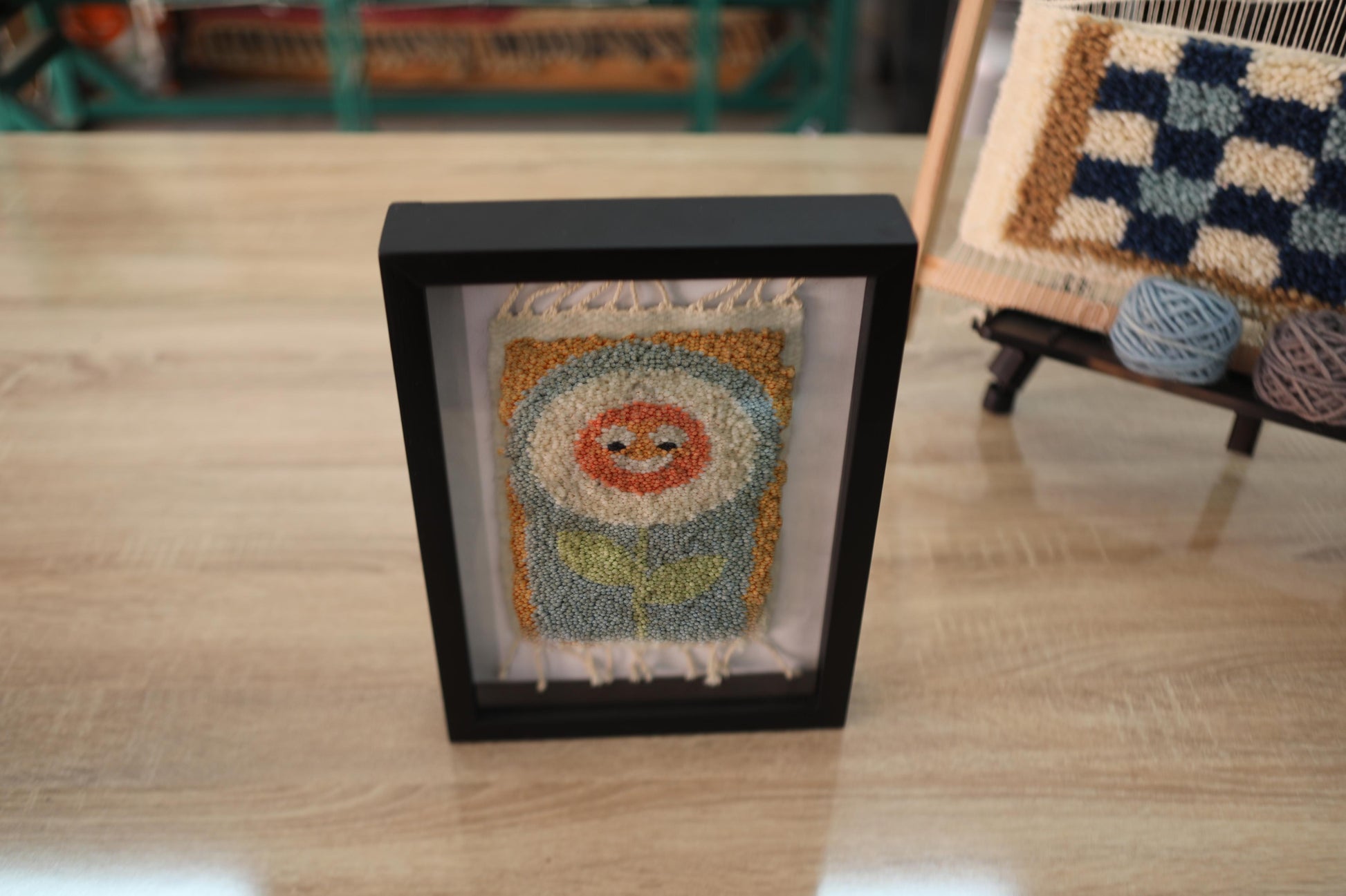 smiling flower rug, happy face moroccan rug, mini wool wall art, hand-knotted moroccan textile, boho flower decor, kids wall rug, orange cream blue wool art, cheerful handmade rug, framed rug wall hanging, 25x31 cm moroccan wall art
