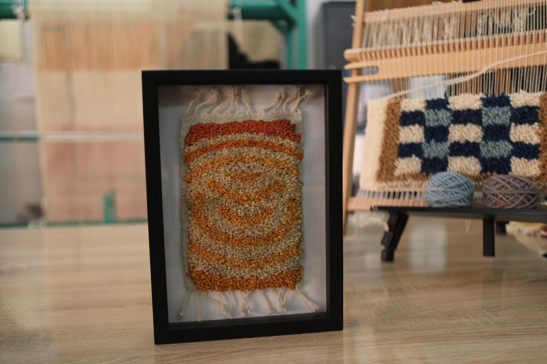 spiral moroccan rug, framed moroccan textile art, hand-knotted wool rug, boho wall decor, knot by knot rug, orange spiral wall hanging, mini moroccan rug, artisan wall piece, framed rug 25x31 cm, earthy tone moroccan rug
