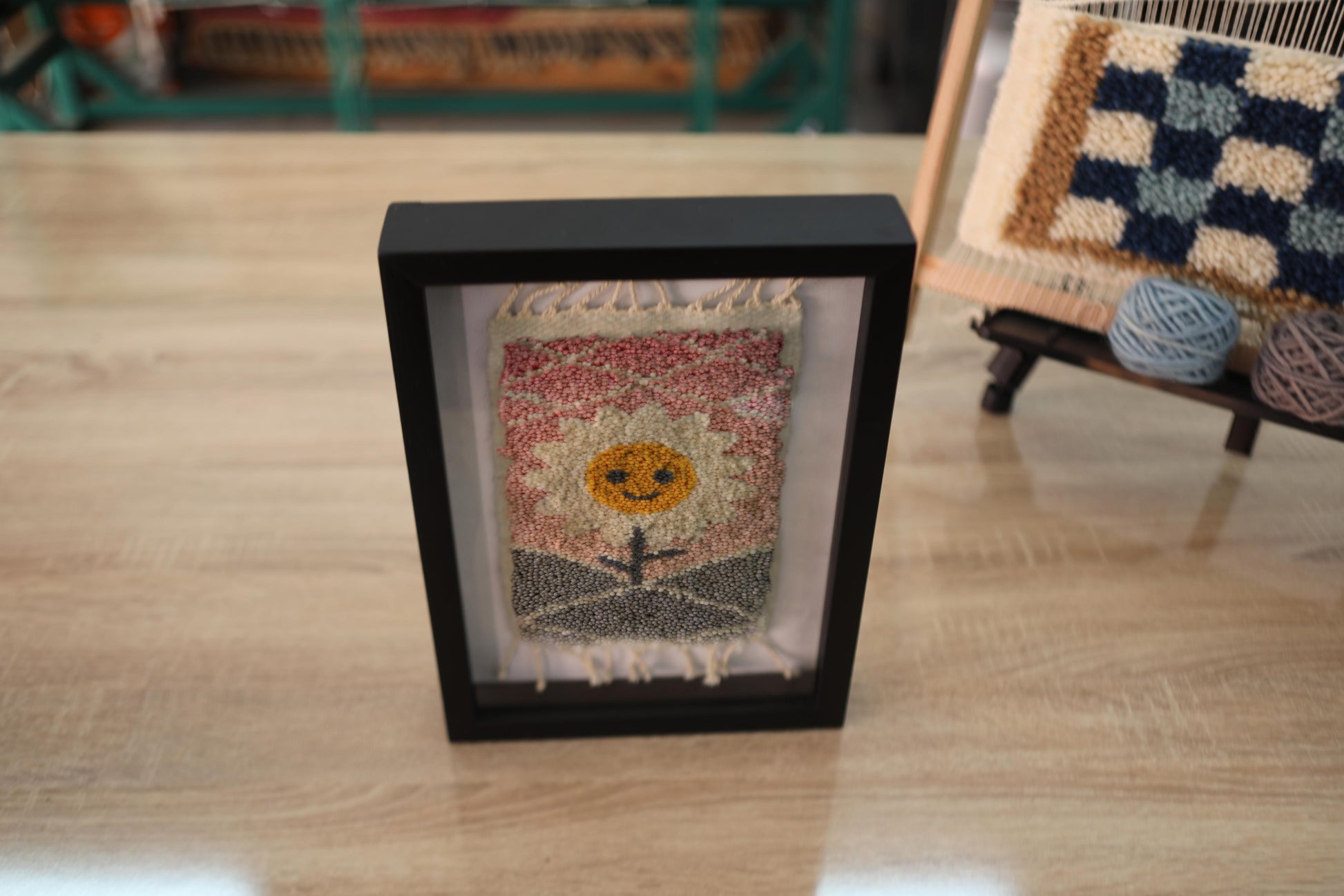 sunflower mini rug, hand-knotted moroccan rug, smiling flower wall art, moroccan wall decor, sunset textile art, mini wool rug, framed rug artwork, boho home decor, moroccan rug flower, knot by knot weaving, 25x31 cm handmade rug

