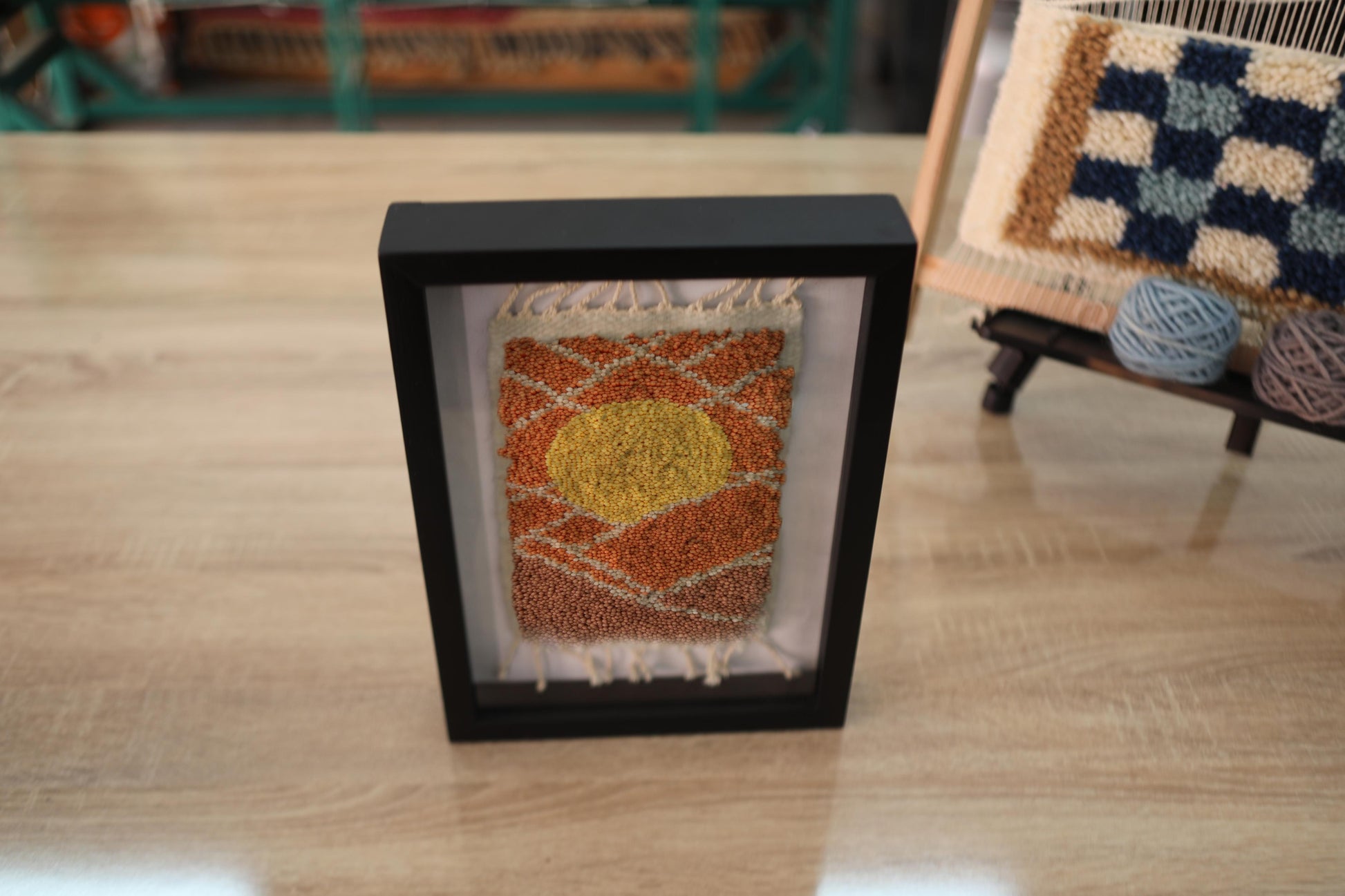 sun moroccan rug wall art, hand-knotted wool tapestry, framed mini rug, moroccan sun wall decor, boho wool art, desert sunset textile, artisan moroccan weaving, knot by knot rug, 25x31 cm mini wall rug, sunrise decor
