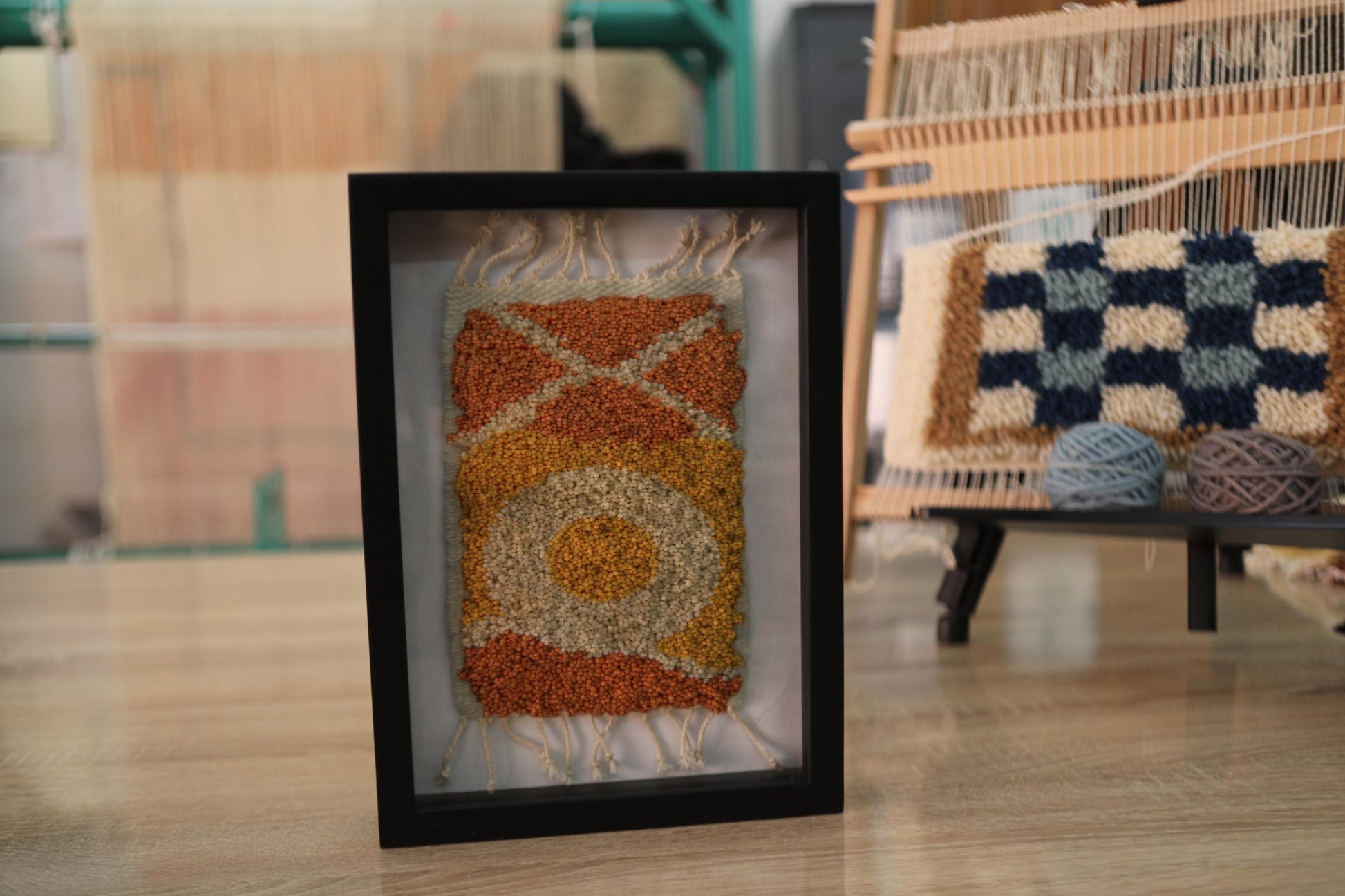 sun motif moroccan rug, framed moroccan wall art, hand-knotted wool rug, small moroccan rug artwork, knot by knot rug, bohemian wall decor, moroccan textile art, orange and yellow mini rug, 25x31 cm rug wall hanging, artisan moroccan wool tapestry
