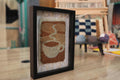 sunrise coffee wall art, moroccan rug, hand knotted textile art, framed wool mug decor, boho kitchen wall hanging, knot by knot rug, artisan coffee rug, handmade wool frame, 25x31 cm, morning coffee decor
