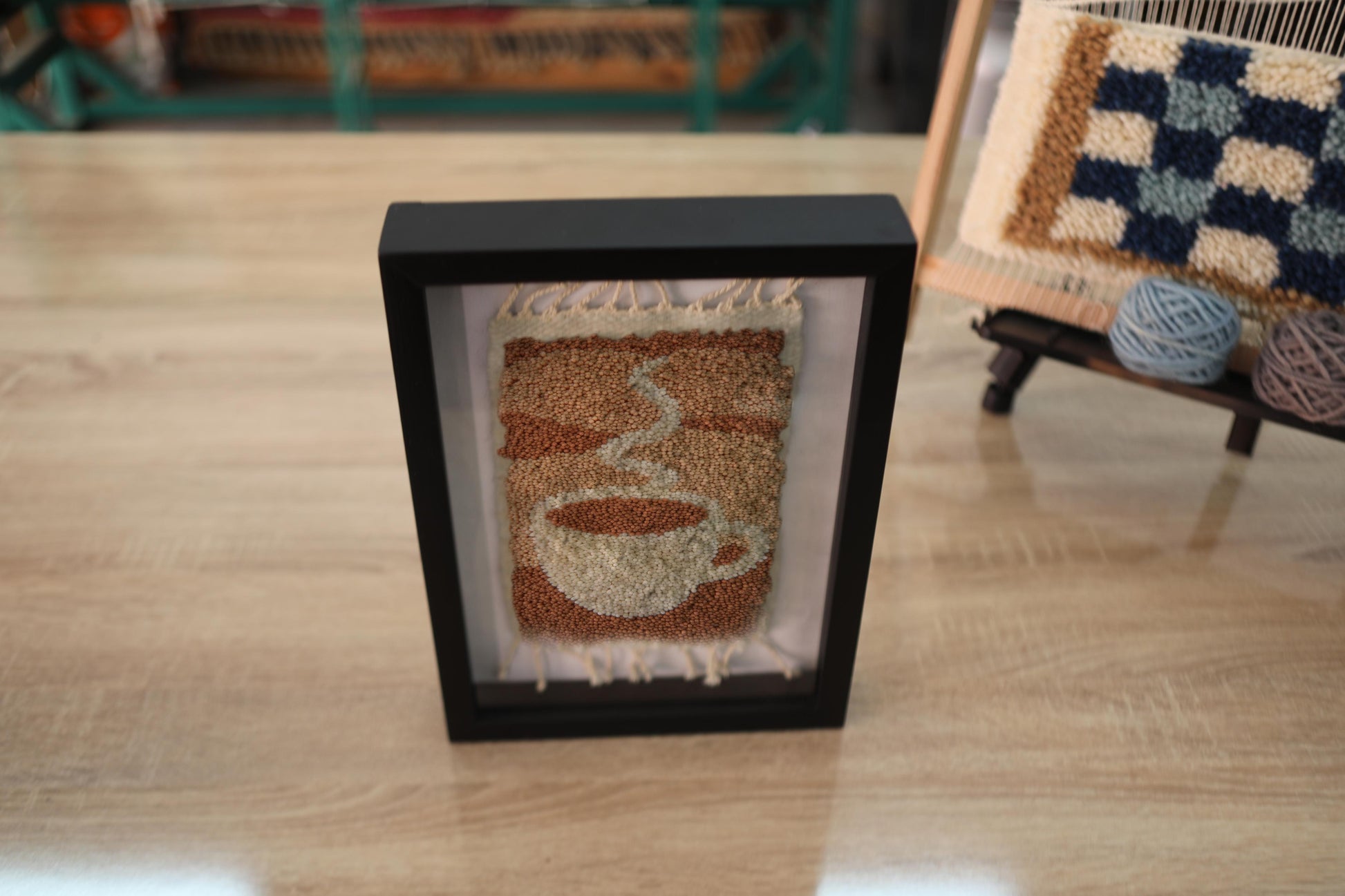 sunrise coffee wall art, moroccan rug, hand knotted textile art, framed wool mug decor, boho kitchen wall hanging, knot by knot rug, artisan coffee rug, handmade wool frame, 25x31 cm, morning coffee decor
