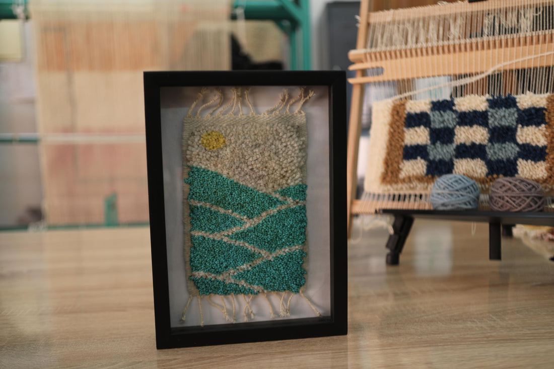sunrise rug, moroccan rug, mountain landscape wall art, yellow sun wool tapestry, framed textile art, green hills rug, knot by knot weaving, moroccan decor wall hanging, wool framed rug, artisan moroccan rug design
