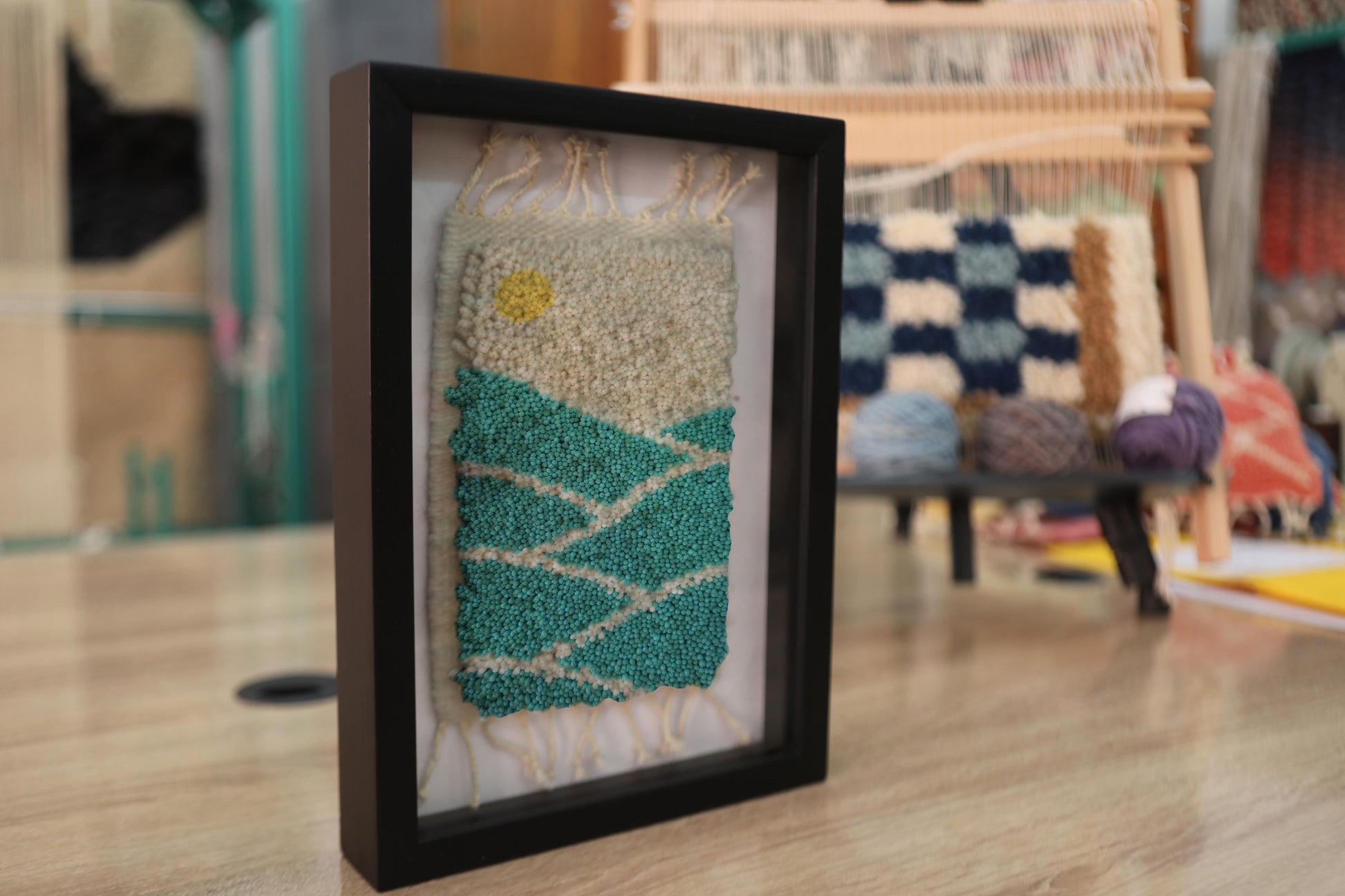 sunrise rug, moroccan rug, mountain landscape wall art, yellow sun wool tapestry, framed textile art, green hills rug, knot by knot weaving, moroccan decor wall hanging, wool framed rug, artisan moroccan rug design
