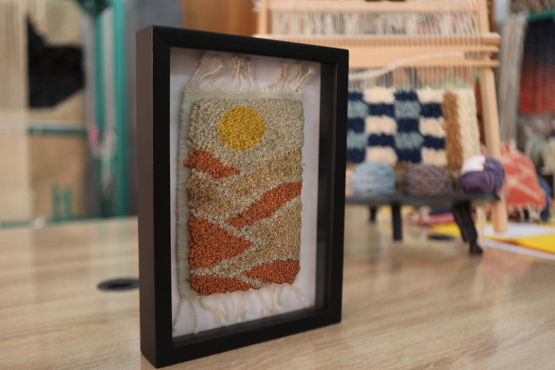 sunset dunes moroccan rug, framed moroccan textile art, handmade knot by knot rug, moroccan wall hanging, mini wool rug 25x31 cm, desert art moroccan rug, orange beige rug, artisan rug decor, boho framed weaving, contemporary moroccan craft
