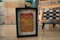 sunset moroccan rug, framed moroccan wall art, diamond moroccan tapestry, boho home decor, hand knotted mini rug, warm color moroccan textile, knot by knot wool art, moroccan rug 25x31 cm, artisanal wool wall hanging, orange yellow red rug art
